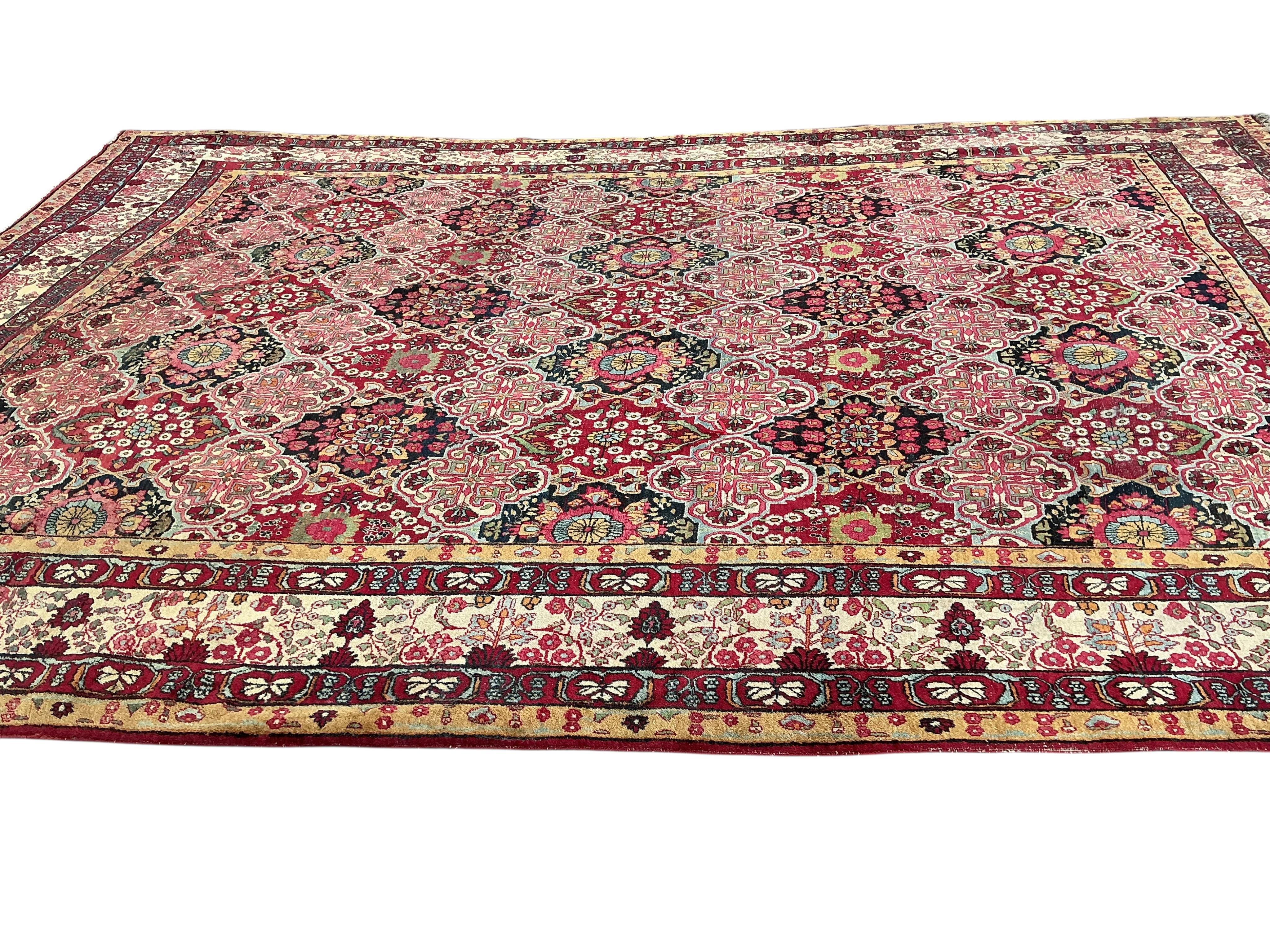 An Agra multi coloured carpet, the ground woven with interlocking oval medallions, 455 x 315cm